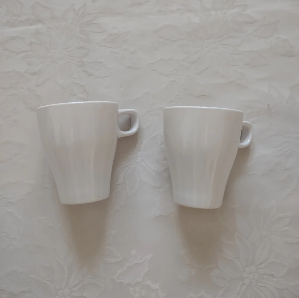 2 white tall cups mugs IKEA Sweden coffee tea